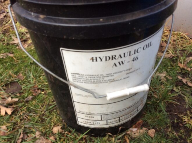 Four gallons of hydraulic fluid
