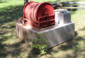 Fire brush rig water tank and hose reel