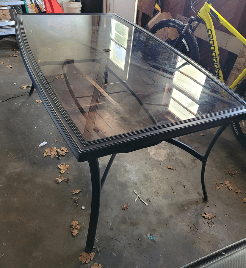 Glass-top outdoor patio table